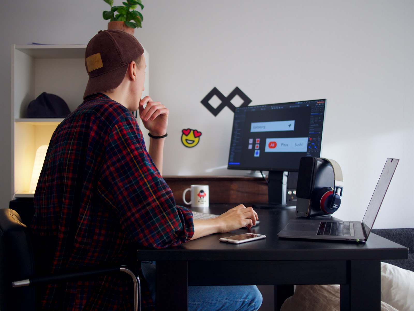 Software developer building a custom CRM at a modern workstation