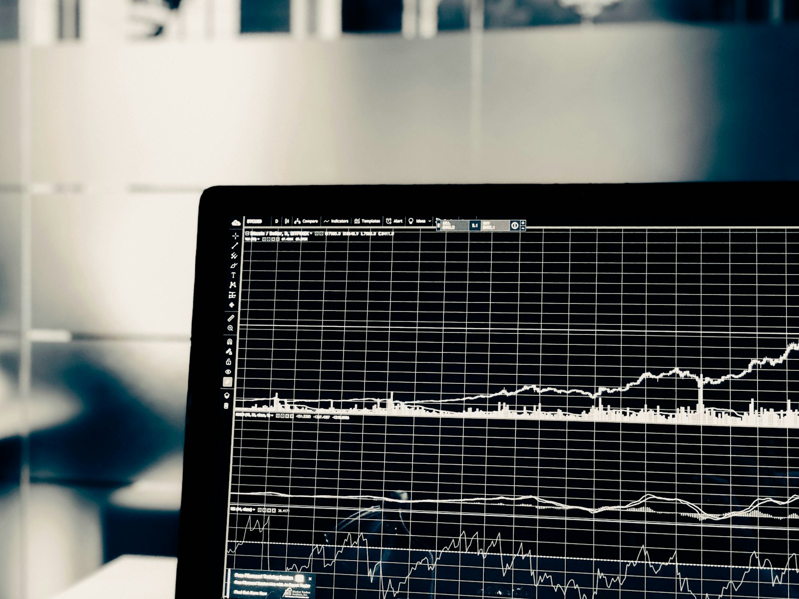 Analyst reviewing financial operations dashboards on a laptop
